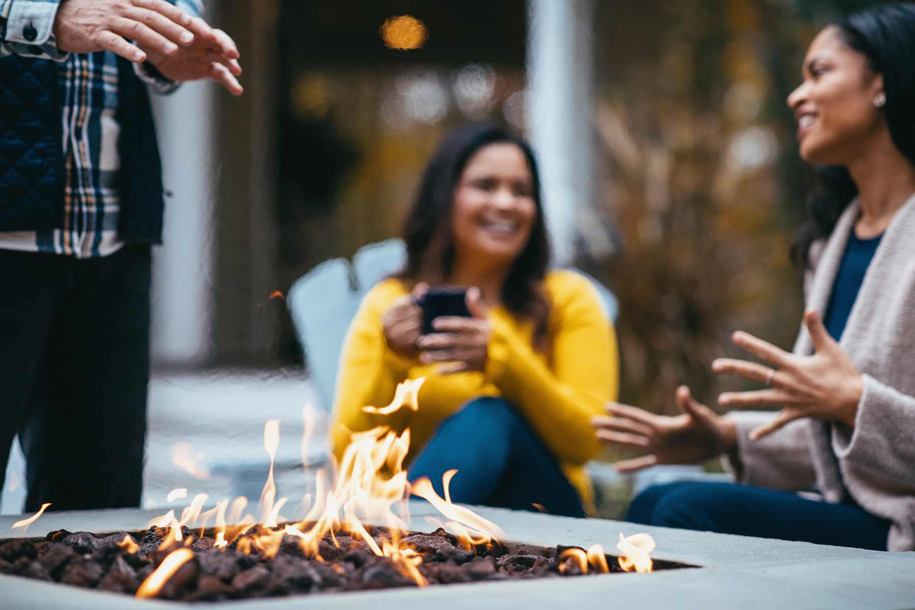 people talking around fire